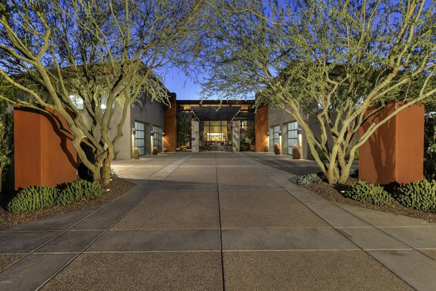 Modern concrete and aggregate driveway at luxury home