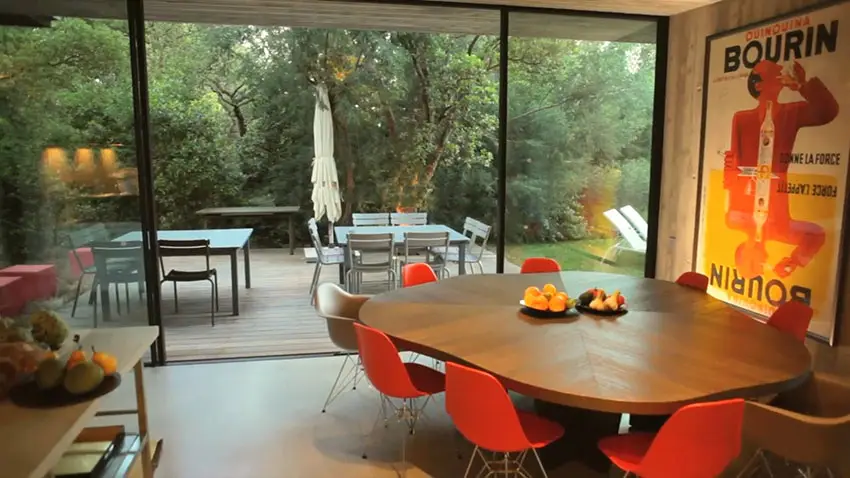 Modern dining room with outdoor views to deck