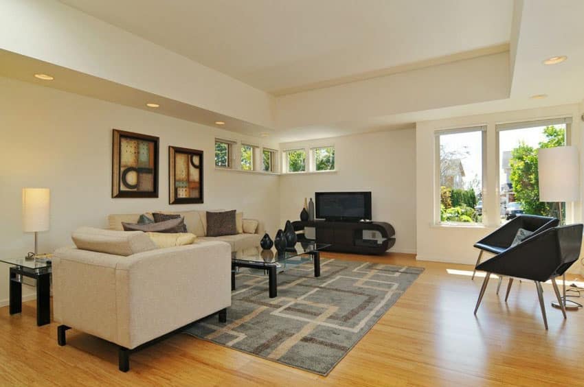 Room with black chairs, whiter lampshade and panel windows