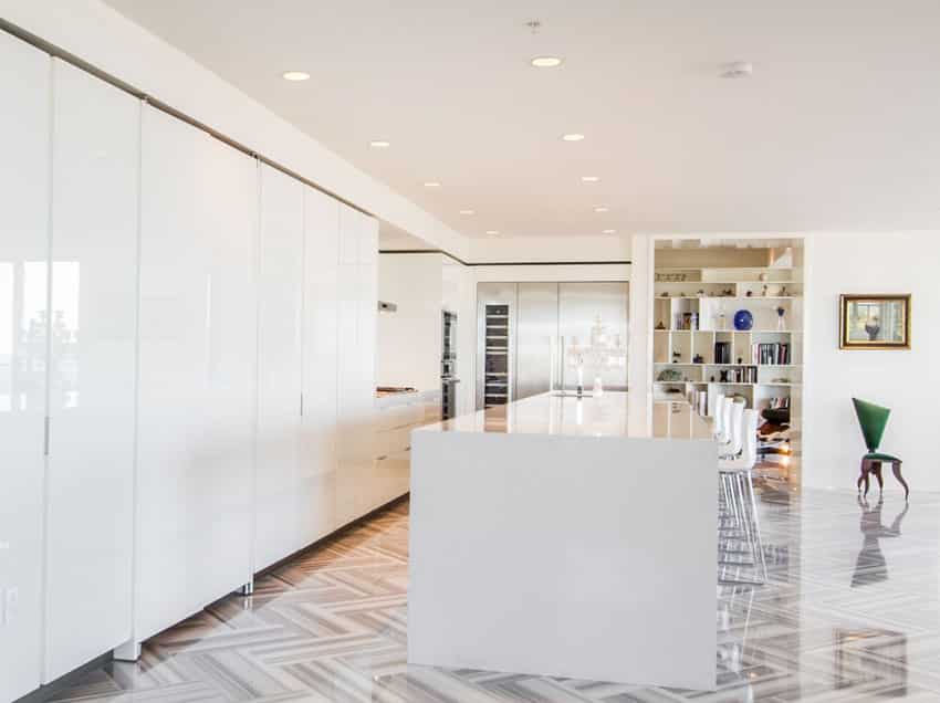 Modern white cabinet kitchen with quartz countertop and porcelain tile floors