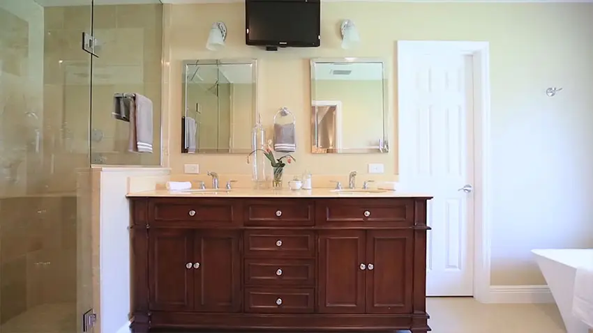 View of dual sink vanity shower and bathtub