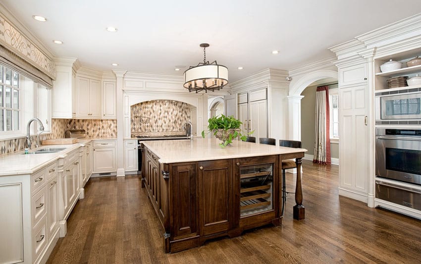 Kitchen with large wood center island and diamond-shaped backsplash