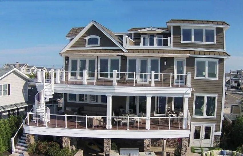 4 story house on water with viewing decks