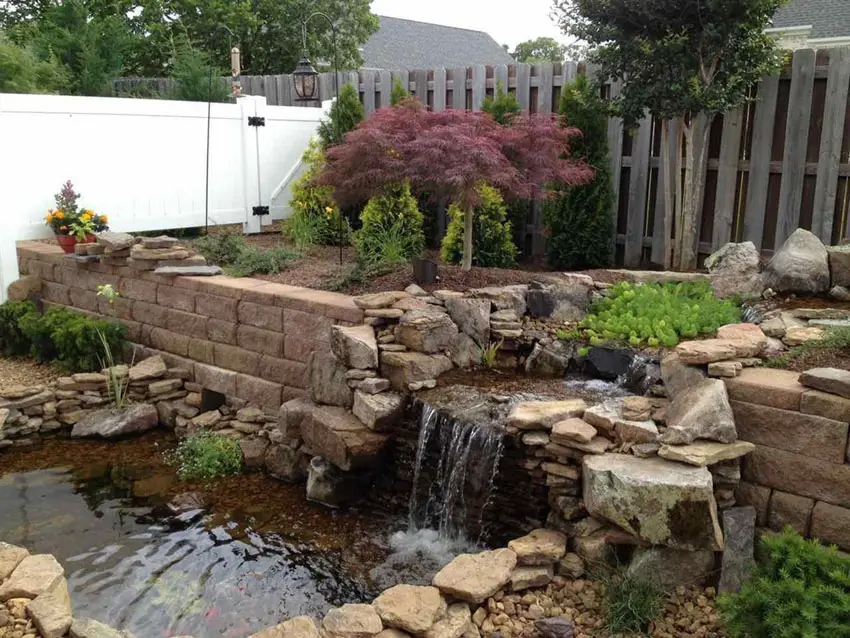 Backyard waterfall over paver retaining wall