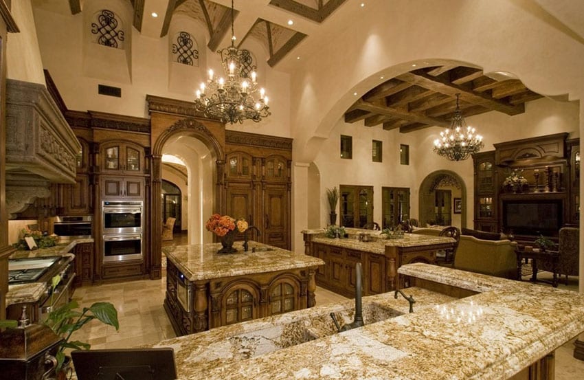 Beautiful Mediterranean kitchen with high ceilings yellow river granite counters