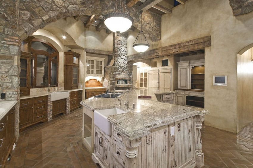 Beautiful stone kitchen with fireplace and curved island