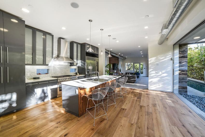 Kitchen with off white ceilings, glass wall, and grey cabinets