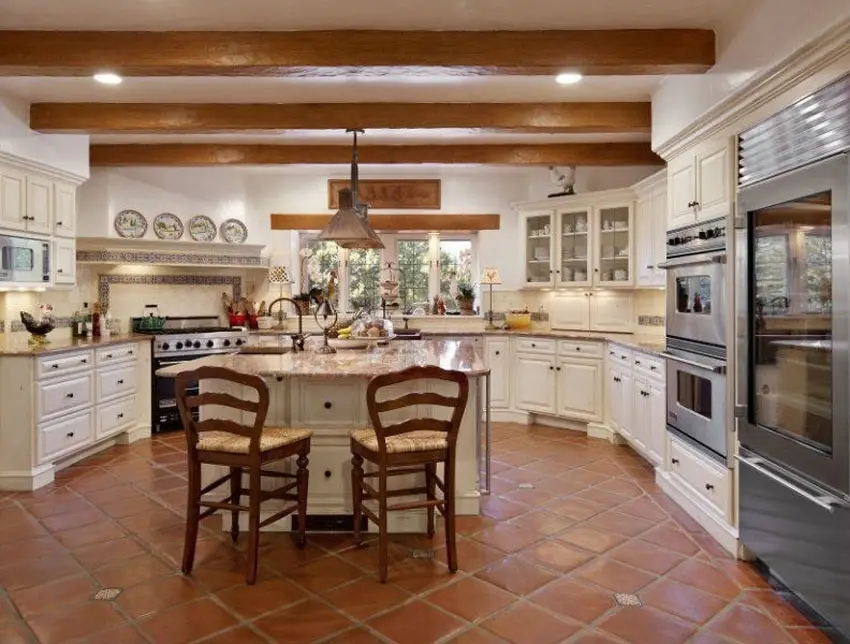 Kitchen with white ceiling, exposed ceiling and panel cabinets