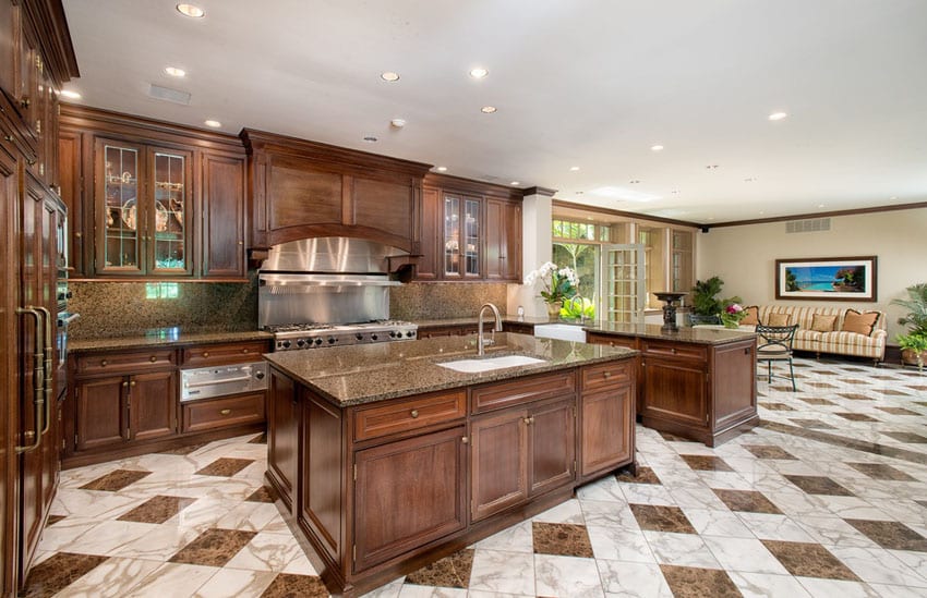 Craftsman kitchen with brown granite counter and marble tile flooring