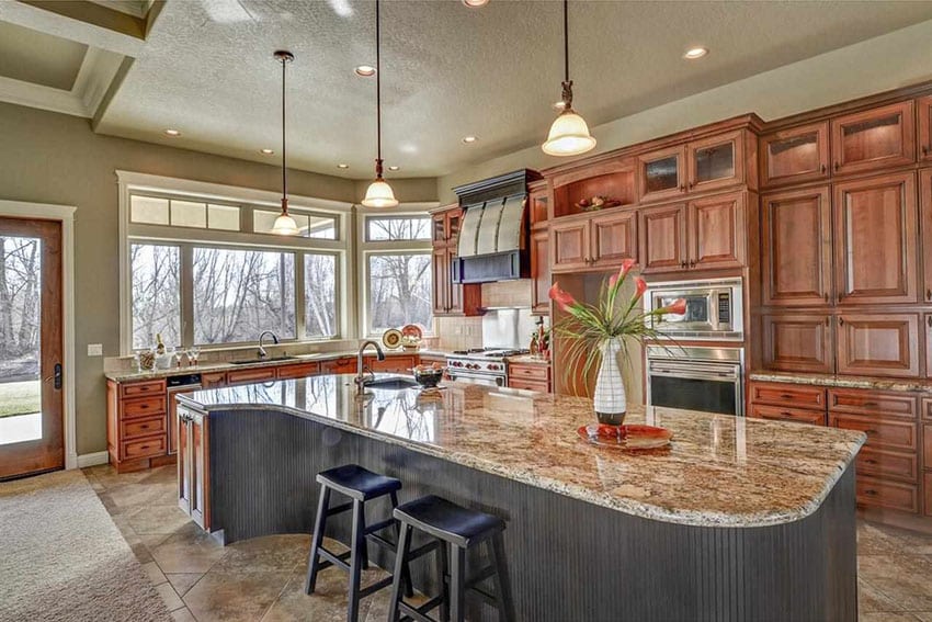 Craftsman kitchen with large island with cream granite and porcelain flooring