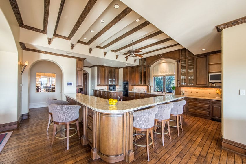 Craftsman kitchen with long l-shaped breakfast bar island