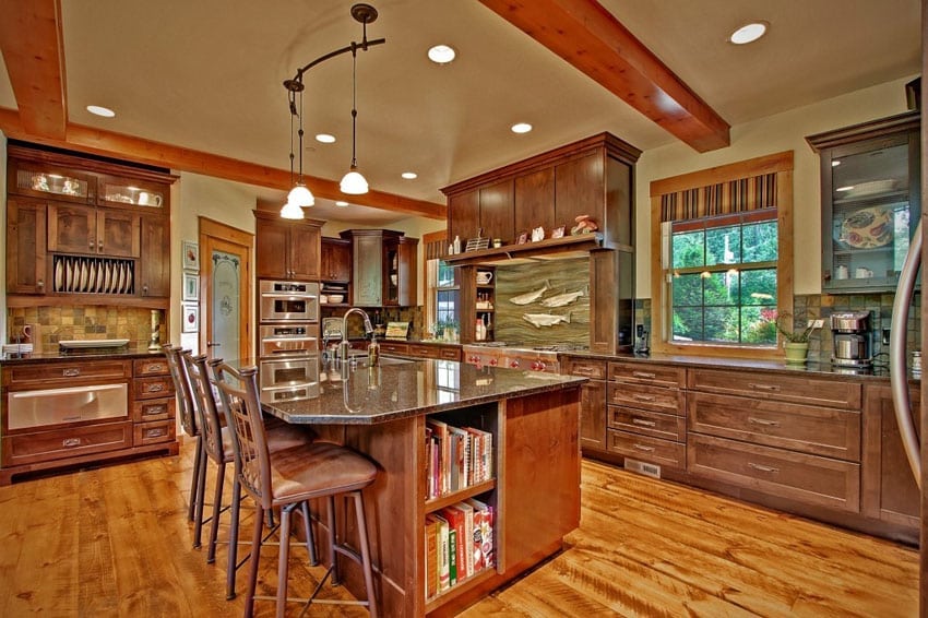 Country kitchen with center island, pine floors and pendants