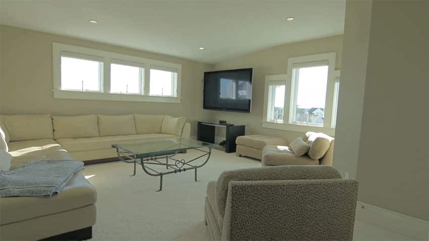 Cream color living room with large sectional couch