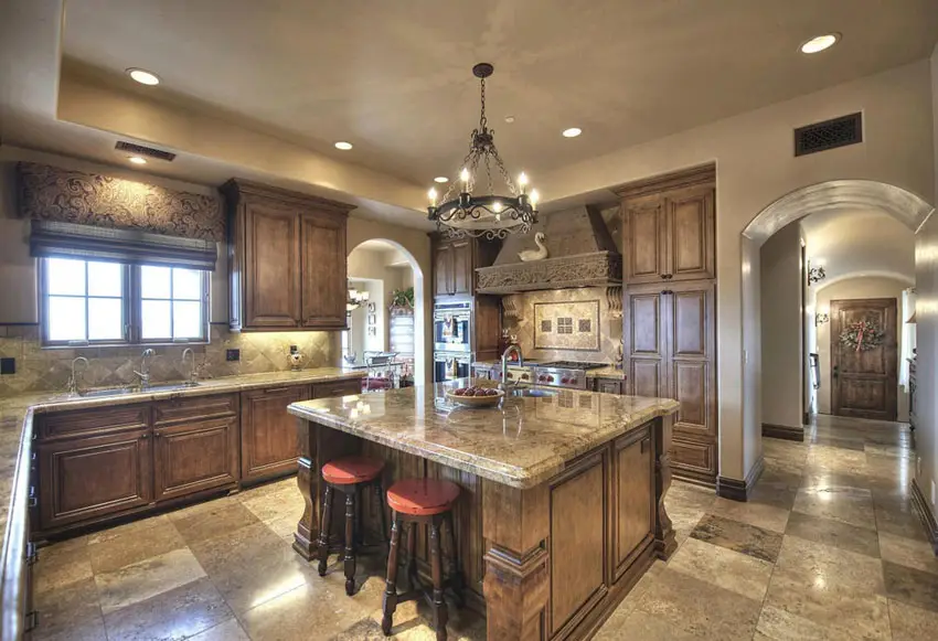 Kitchen with rustic iron chandelier and large island