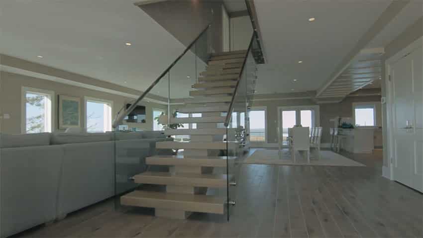 Foyer entrance with custom stairs at four story house