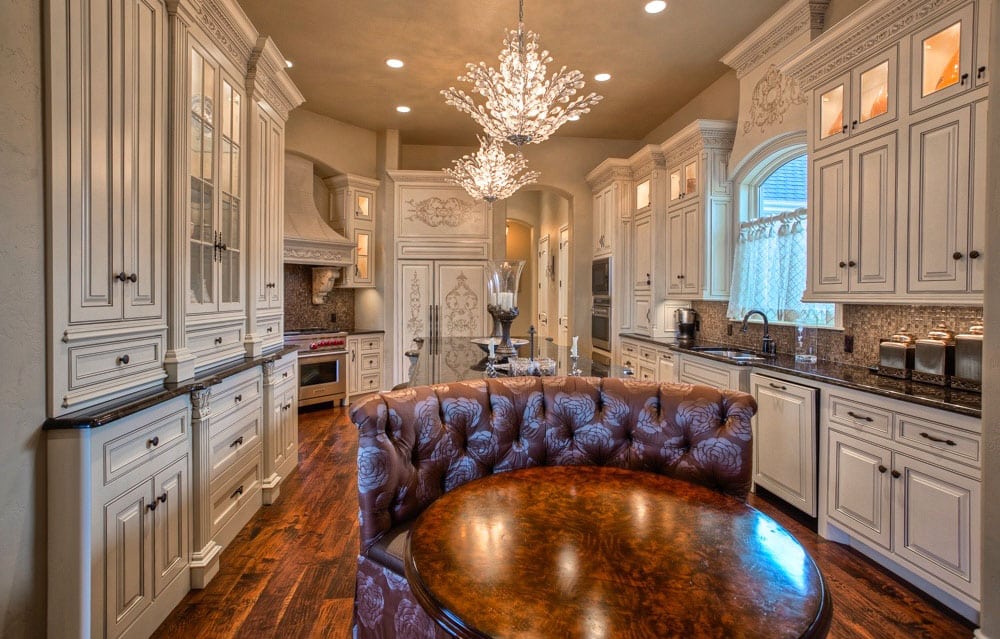 Cream color inset cabinets and absolute black counters