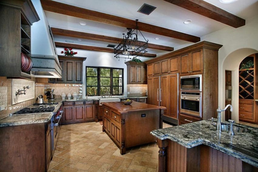 Kitchen with green granite counters and butcher block island