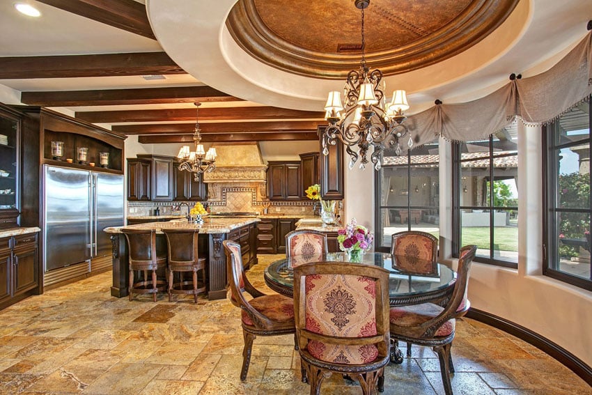 Luxury Mediterranean kitchen with gold travertine floors and cupola dining room