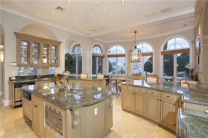 Kitchen with arched windows and recessed lights