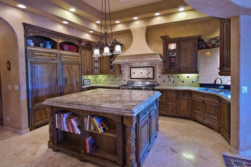 Mediterranean kitchen with golden bordeaux granite counters raised panel cabinetry