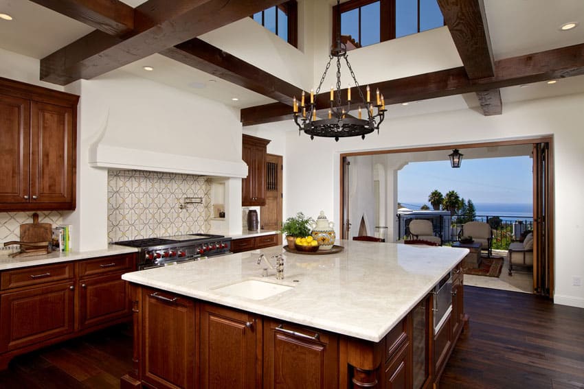 Kitchen with ocean view, raised ceiling and wood floors