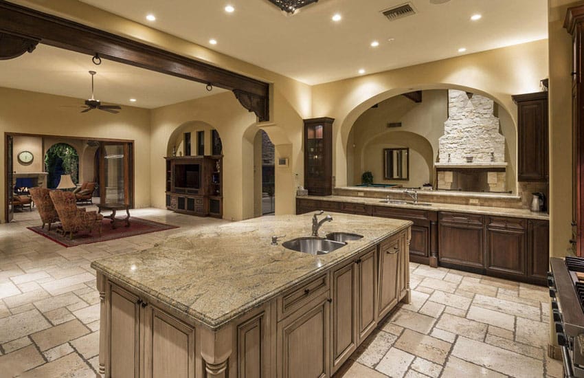 Mediterranean kitchen with typhoon bordeaux granite and antique white colored island