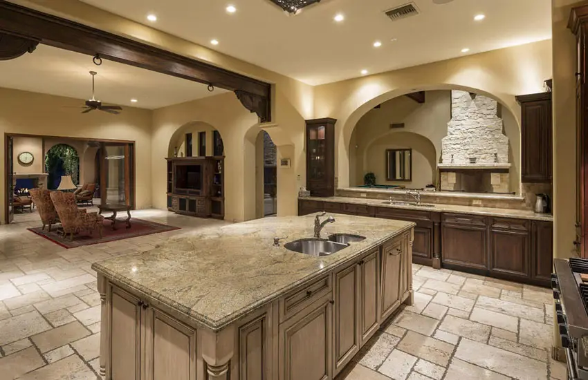 Mediterranean kitchen with typhoon bordeaux granite and antique white colored island
