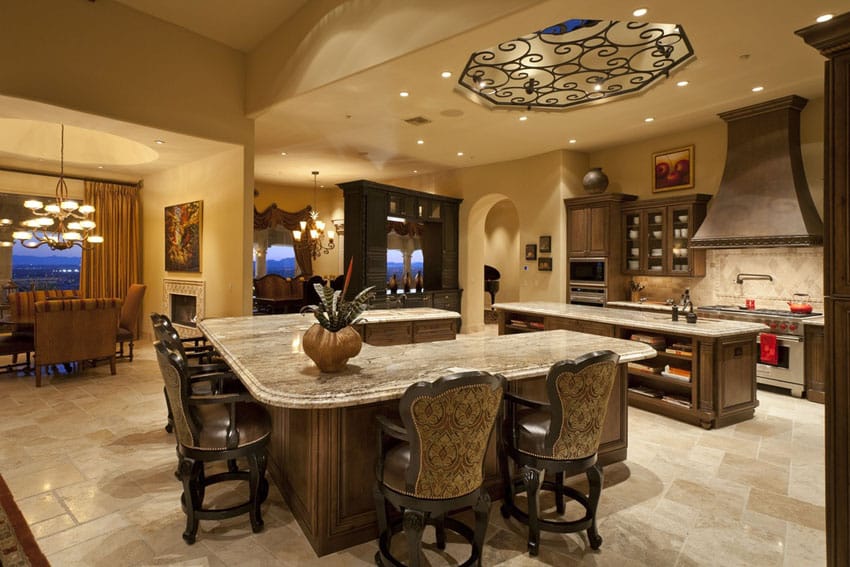 Mediterranean kitchen with u shaped breakfast bar and wrought iron cupola