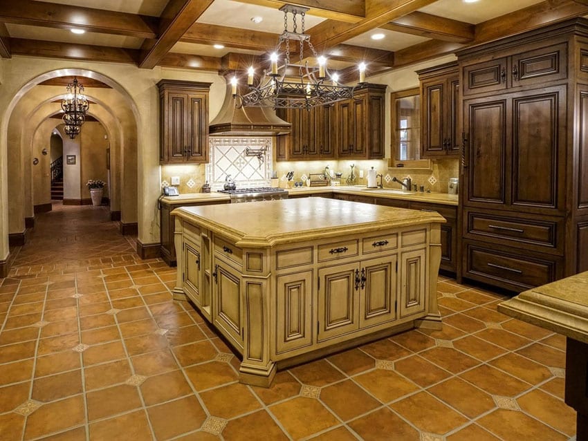 Kitchen with crema cappuccino marble countertop and adobe tile floors