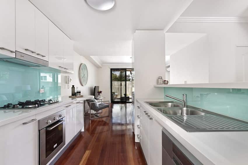 Modern kitchen with painted glass made backsplash