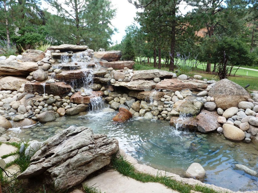 Natural backyard water feature waterfall and pond