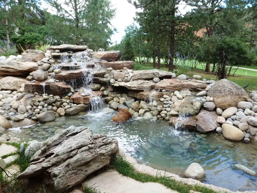 Natural backyard water feature waterfall and pond