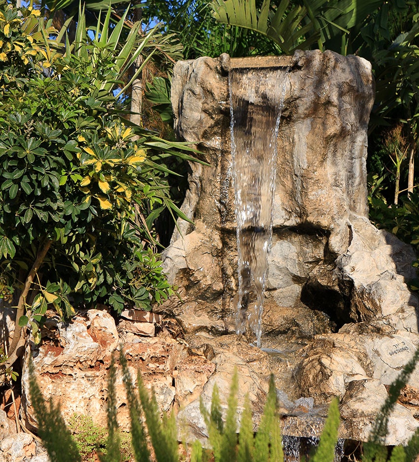 Natural style rock waterfall in garden