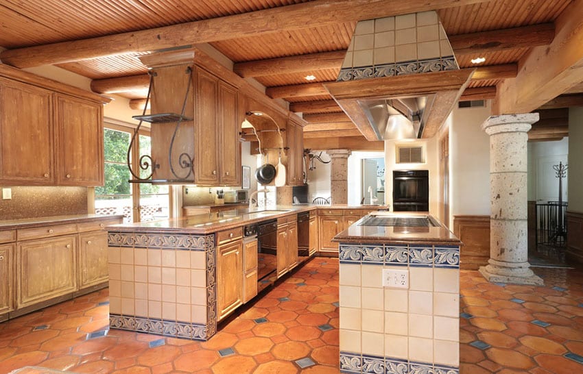 Rustic traditional kitchen with Spanish tiles wood ceiling and terra cotta floors