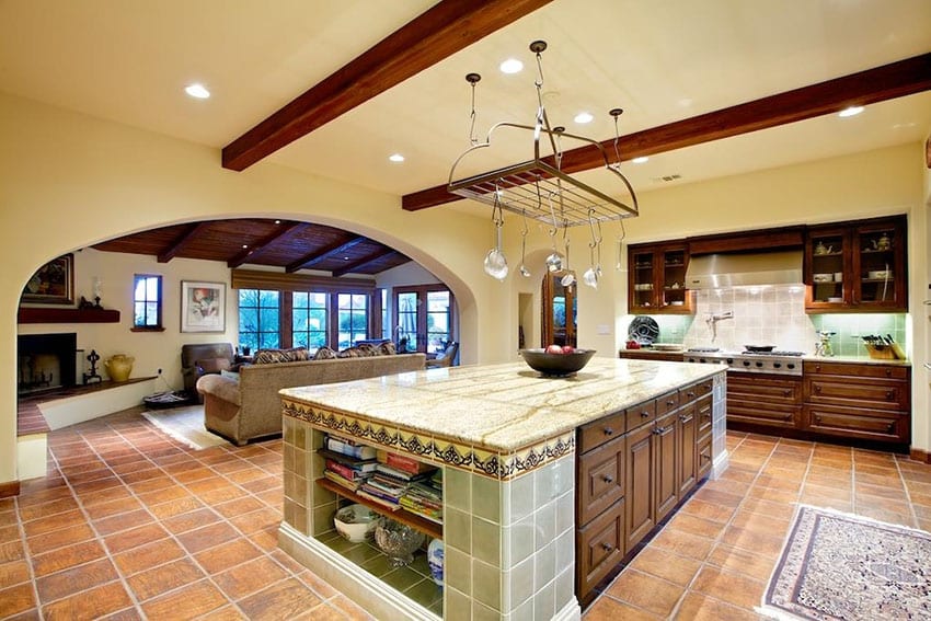 Kitchen with beige walls with cream colored counters and recessed lighting