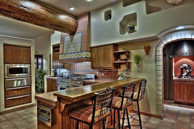 Spanish Style Kitchen With Tile Backsplash And Floors With Breakfast Bar 2016 768x511 