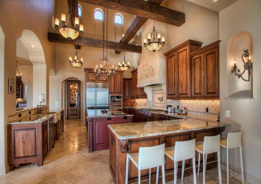 Traditional kitchen with high wood beam ceiling granite counter and tile flooring