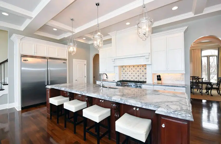 Traditional kitchen with large island and gray marble countertops