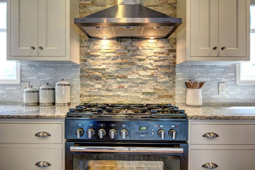 Kitchen with rough quartz backsplash with rectangular glass tiles