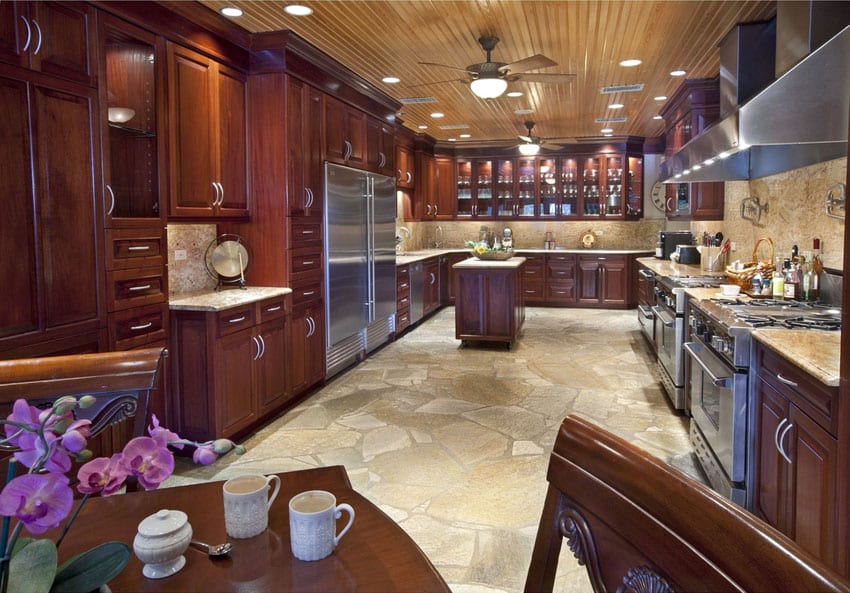 U shaped craftsman kitchen with stone floors