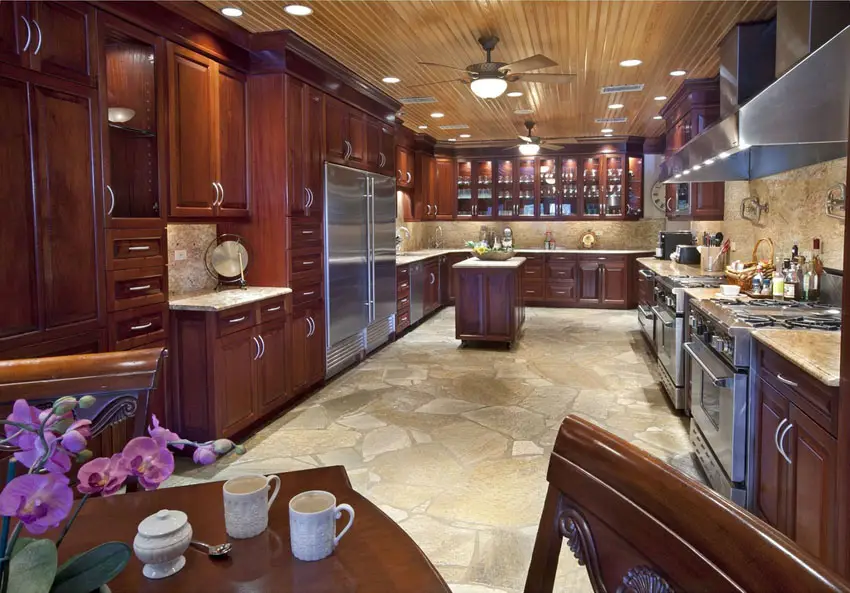 U shaped kitchen with stone floors