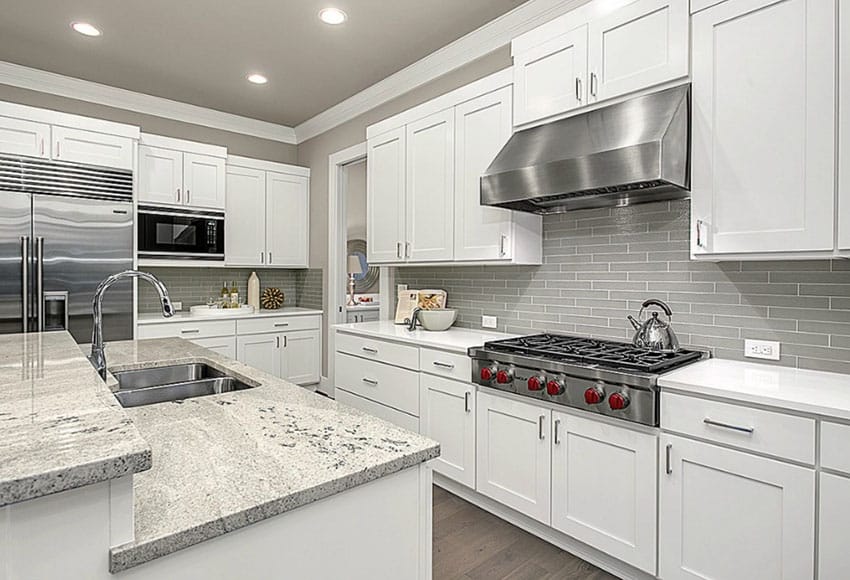 White cabinet kitchen with gray ceramic tile backsplash