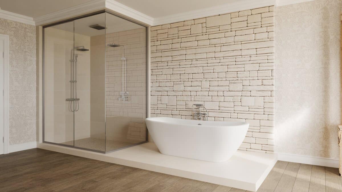 Raised tub beside a stacked-stone wall within a glass wet room