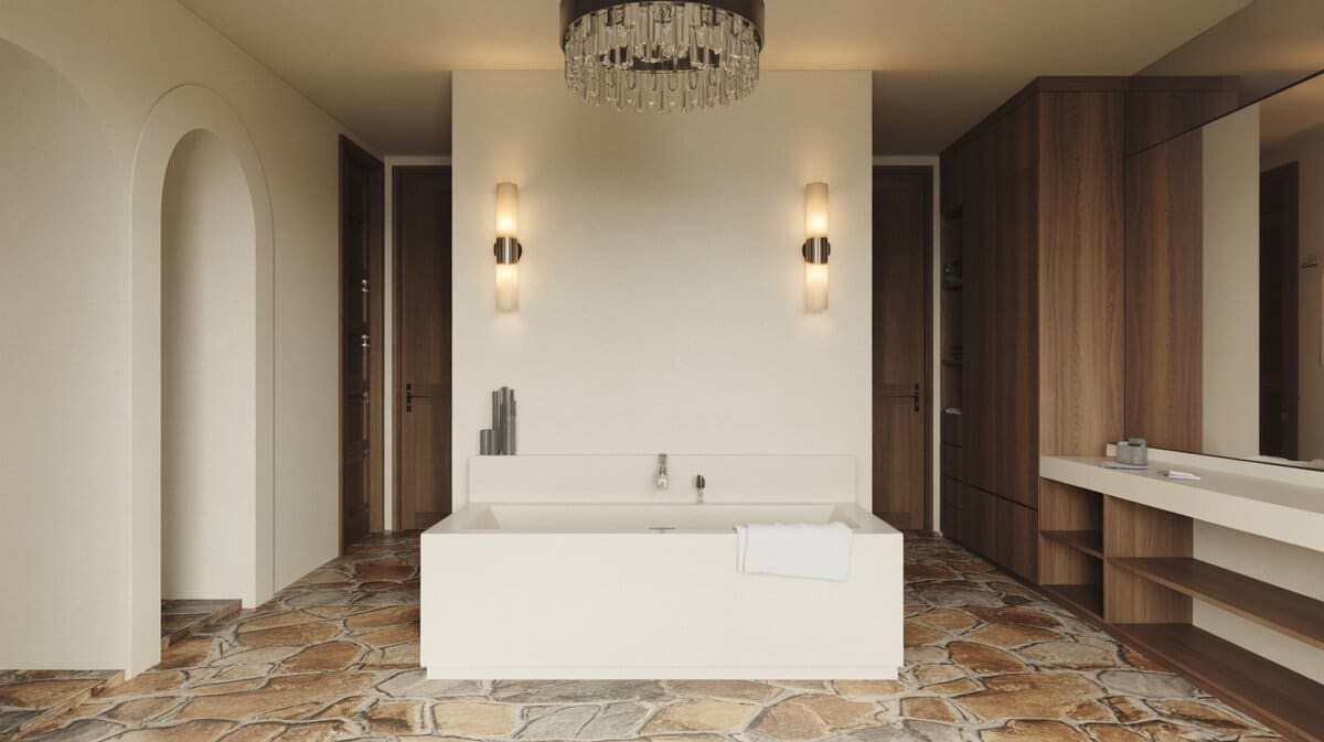 Smooth rectangular tub on rough natural stone beneath a crystal chandelier