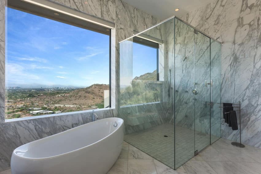 Picture windows and marble tiled walls and floors