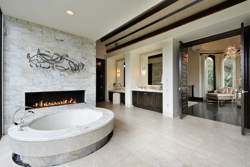 Amazing master bathroom suite with oval bathtub and fireplace