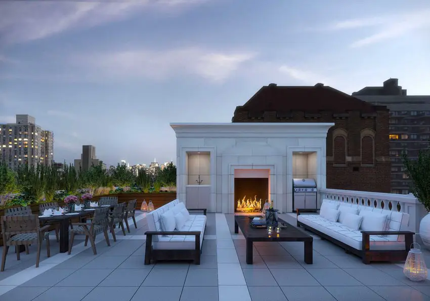 Rooftop patio with a classic fireplace with outdoor grade furniture