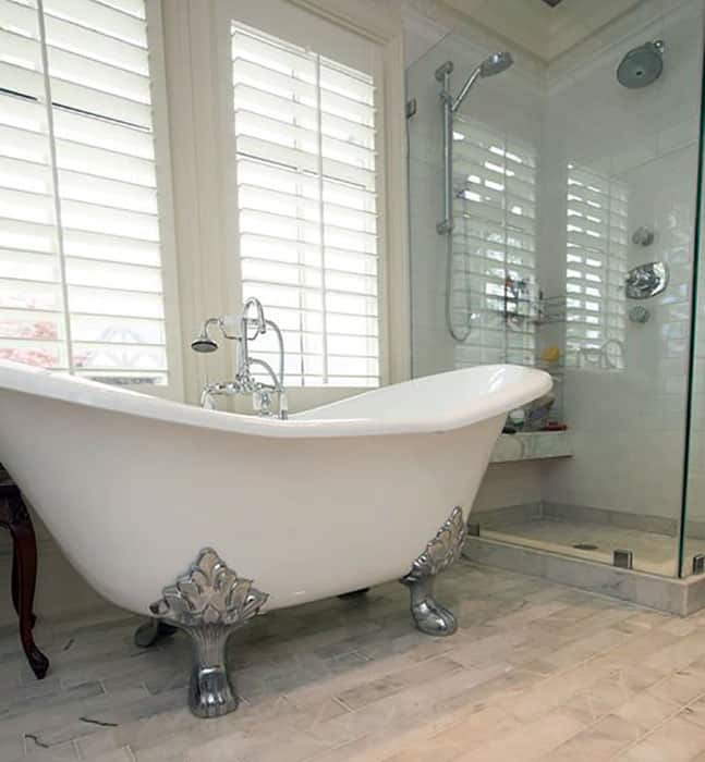 Bathroom with arabella double slipper claw foot tub and glass shower room