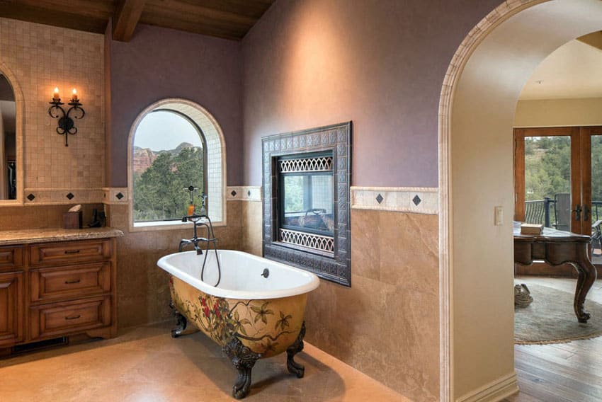 Bathroom with painted clawfoot tub and fireplace