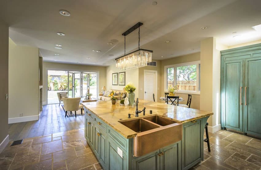 beach style kitchen with green cabinets copper sink and rectangular chandelier